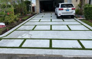 Driveway Exposed Aggregate Concrete with Grass Chases