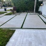 Exposed Aggregate Driveway with Grass Chases & Marble Walks