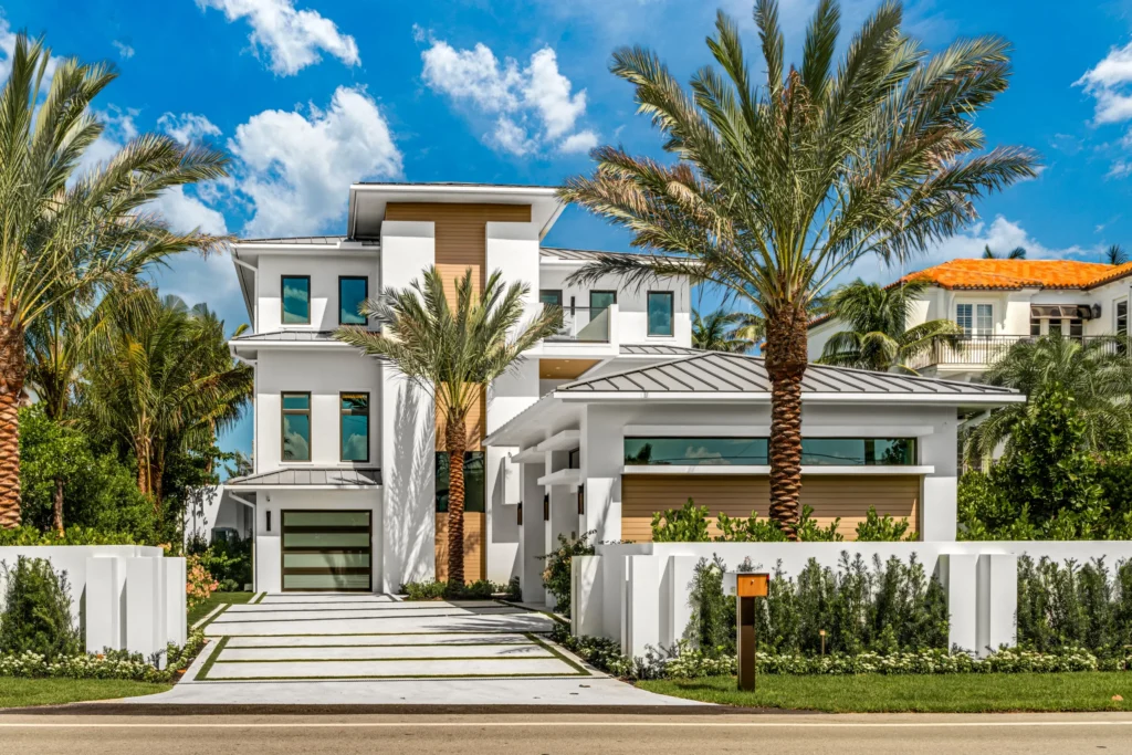 Architectural driveway design using natural shell broadcast concrete at a high end coastal property